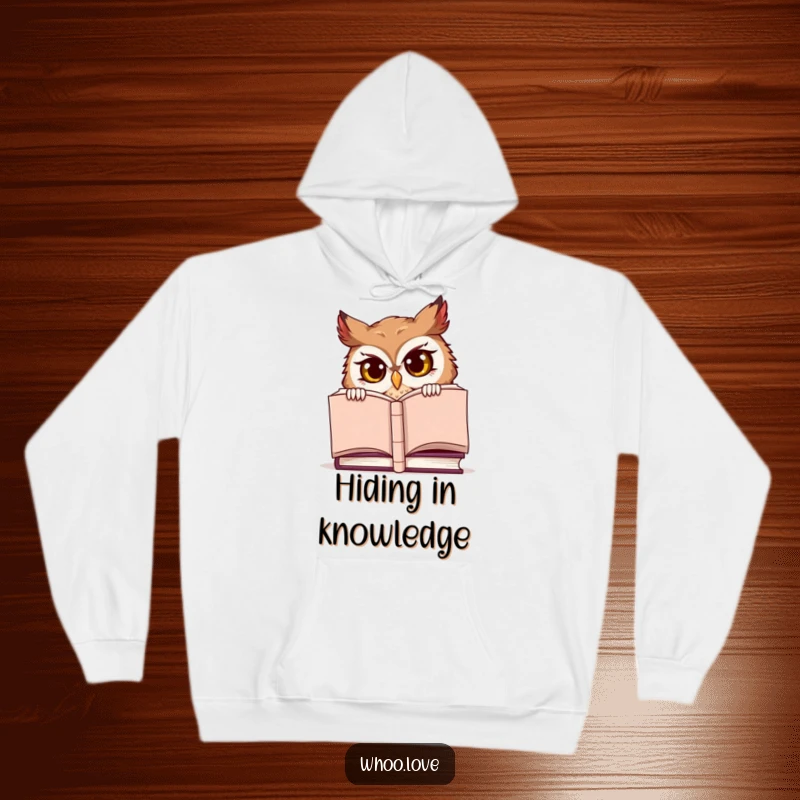 Funny hoodie, a mischievous owl character peeking from behind a large book, offering warmth and humor.