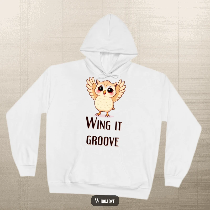 Funny hoodie showcasing a kawaii owl performing a silly dance with its wings spread wide, perfect for cozy grooving.