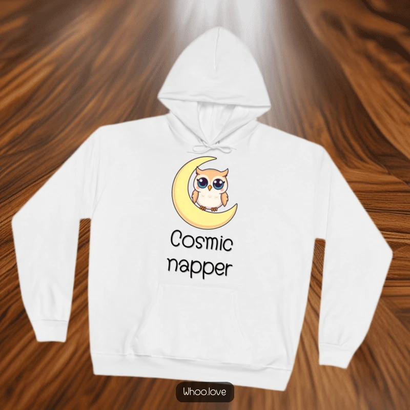 Funny hoodie featuring a small owl with big, curious eyes sitting peacefully on a crescent moon, inspiring dreamy humor.