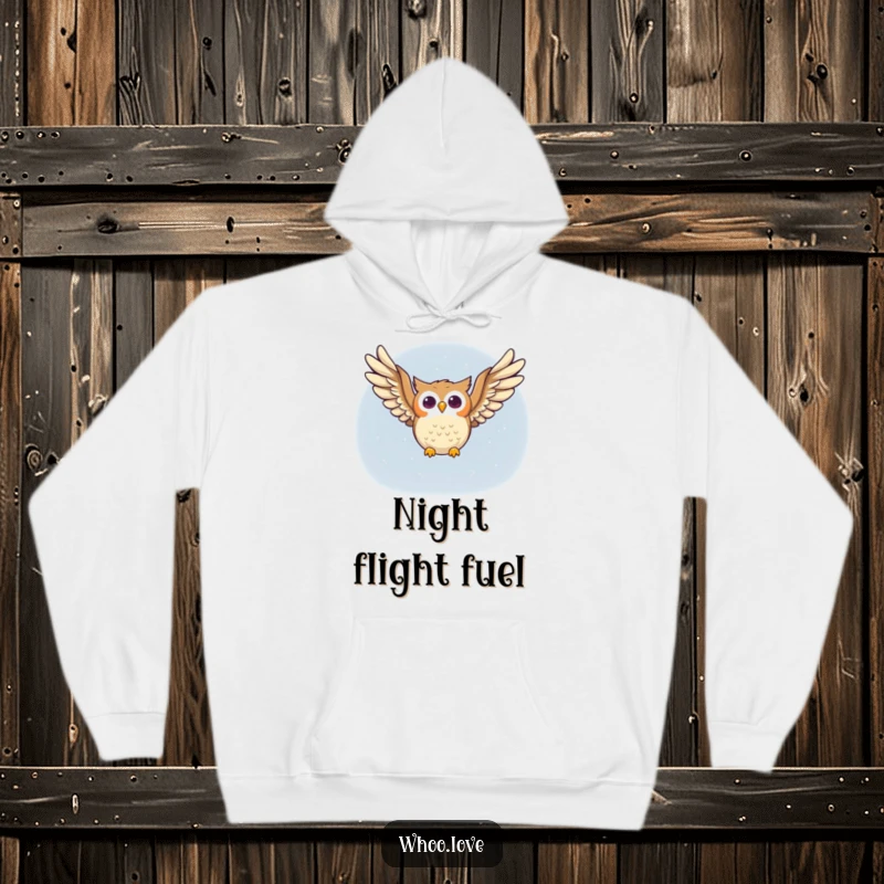 Funny owl hoodie with a happy owl character soaring joyfully through the night sky, wings spread wide, embodying freedom and happiness.