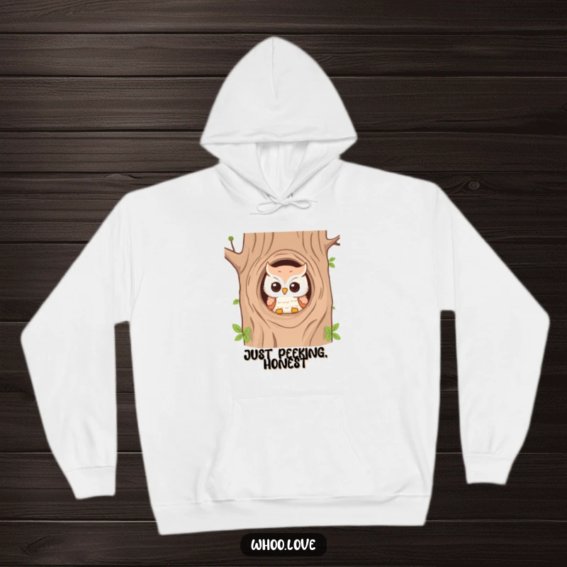 Funny hoodie with an owl peeking from a tree hole, perfect for cozying up and playful vibes.