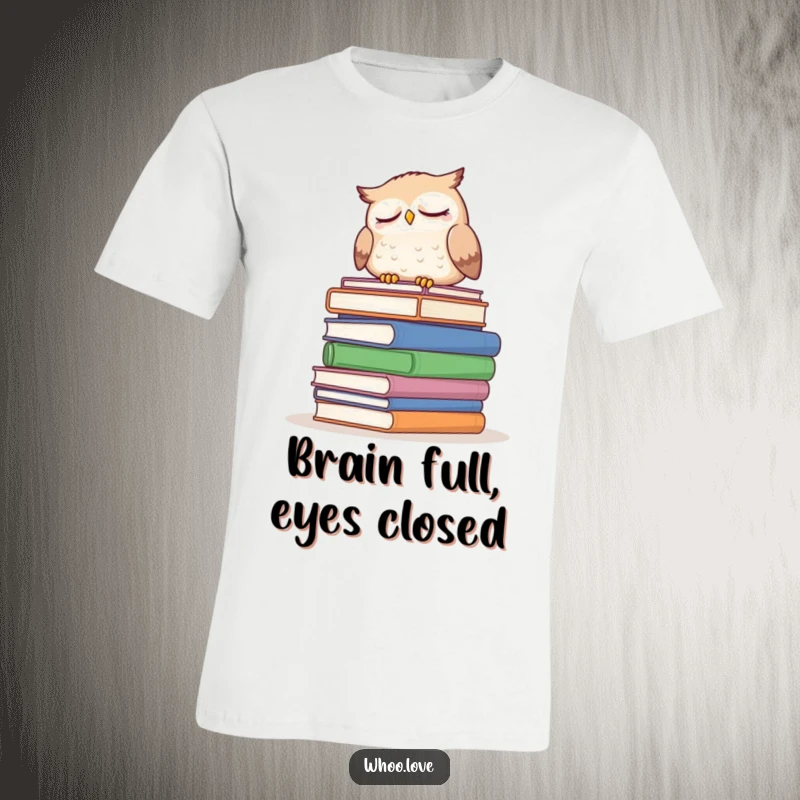 Funny sleepy owl t-shirt featuring an owl dozing on a large stack of books, a humorous and relatable graphic tee for bookworms.