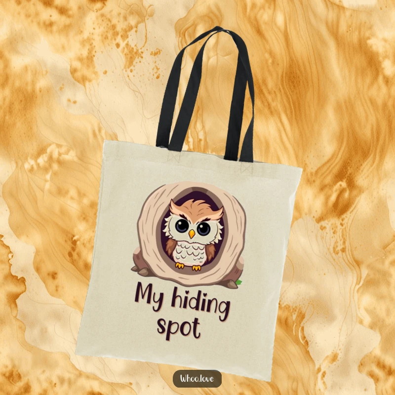 Funny tote bag with a curious owl with ruffled feathers peeking out from the opening of a hollow log.